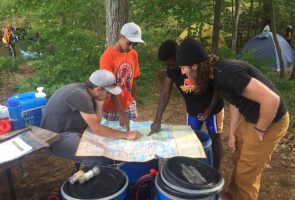 Mentors working through problems with Youths